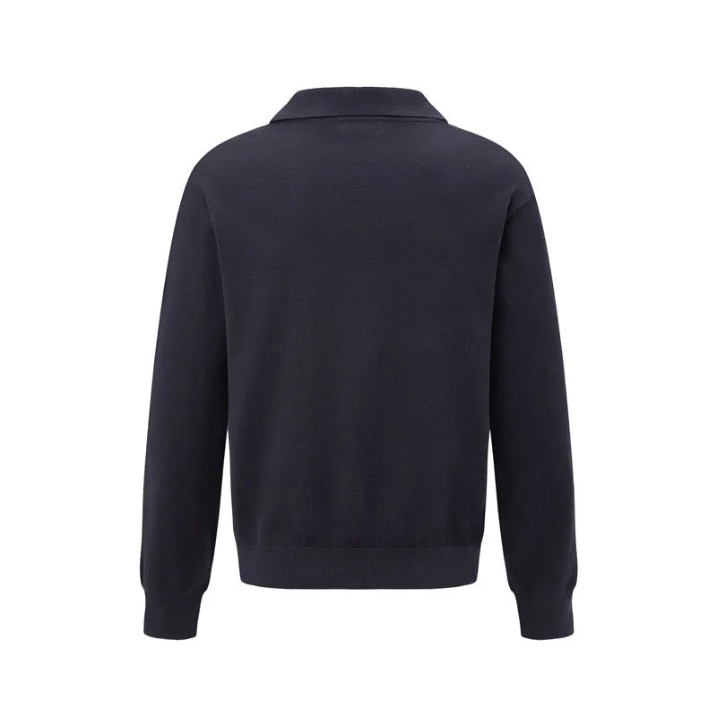 Loose beige acrylic blend pullover sweater on a hanger, showing relaxed fit and texture.