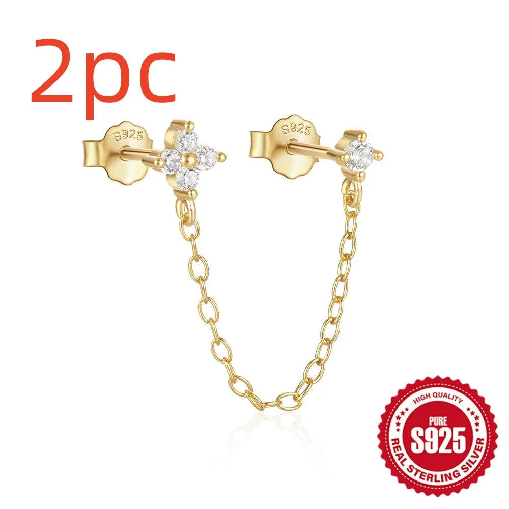 S925 sterling silver geometric drop earrings with flower, tassel, and chain details on an ear clip stud, in a golden tone.