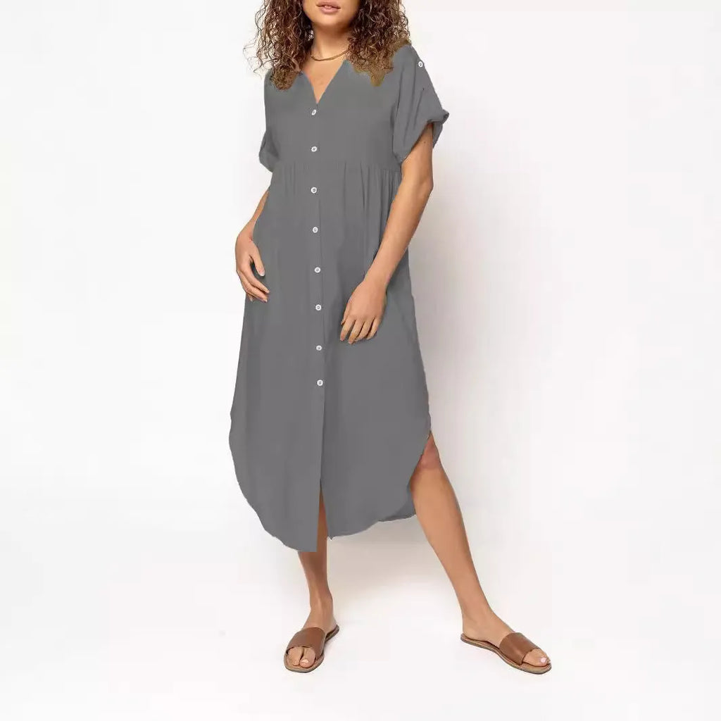 A loose-fitting, mid-length casual dress with a button-down front, shown in a solid colour.