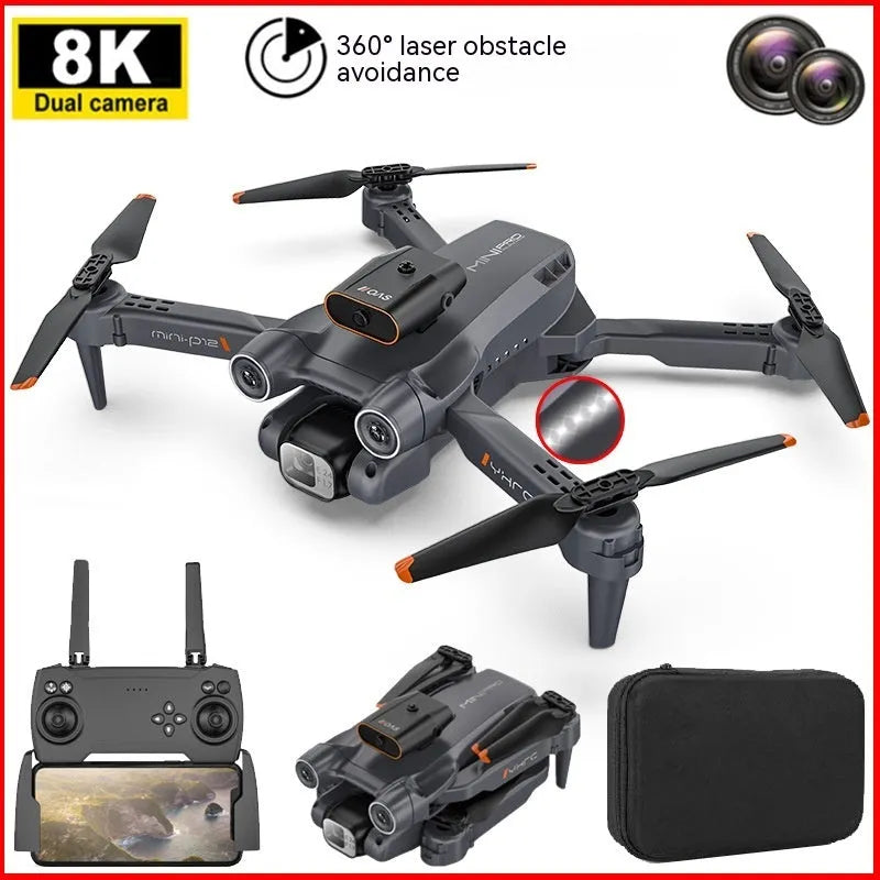 Black foldable quadcopter drone with four propellers and a mounted camera, shown next to its remote control.