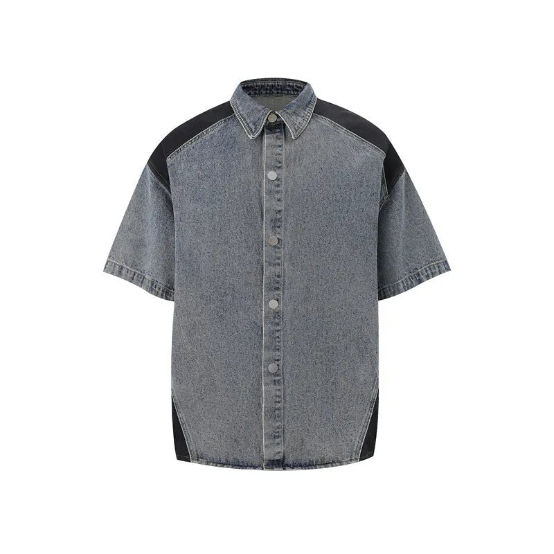 Retro washed denim suit set comprising a short-sleeve jacket and full-length trousers in blue.