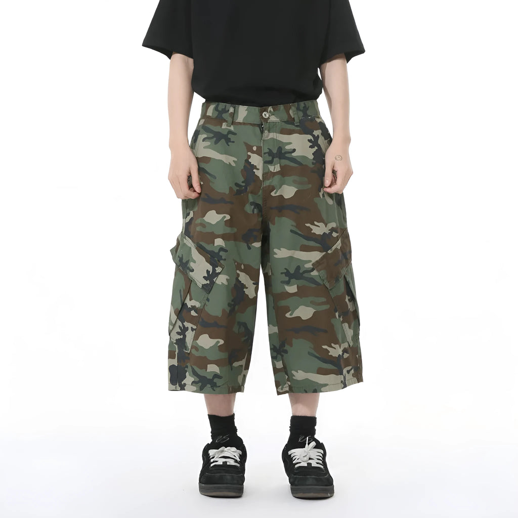 Men's cotton camouflage cargo trousers showing wide leg fit, large pockets, and side stitching details
