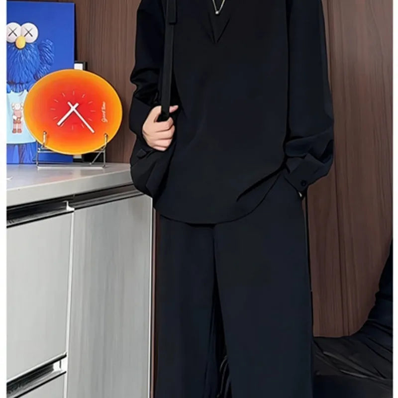 Men's black casual two-piece set with long sleeve polo shirt and matching trousers