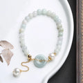 Women's natural emerald jade pearl bracelet with geometric design and traditional Chinese styling