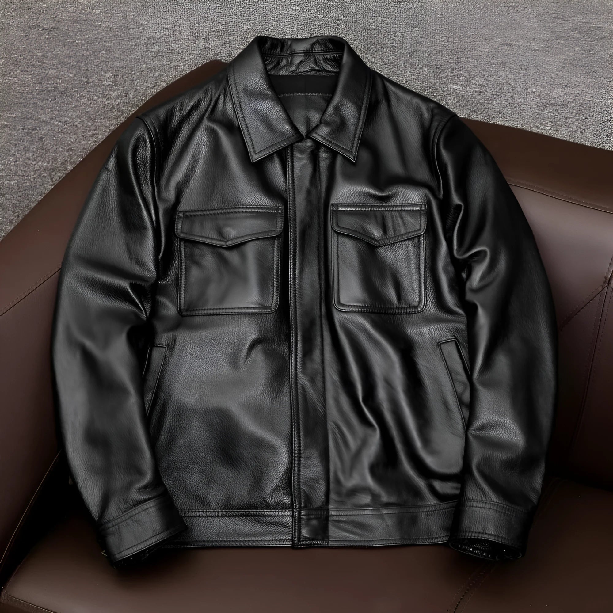 Men's black plus-size loose-fit PU leather lapel jacket with side pockets.