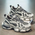 Men's black mesh height increasing sneaker with platform sole and lace-up front.