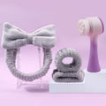 Facial cleansing brush with nylon bristles and coral fleece hair bands in purple, grey or pink colours