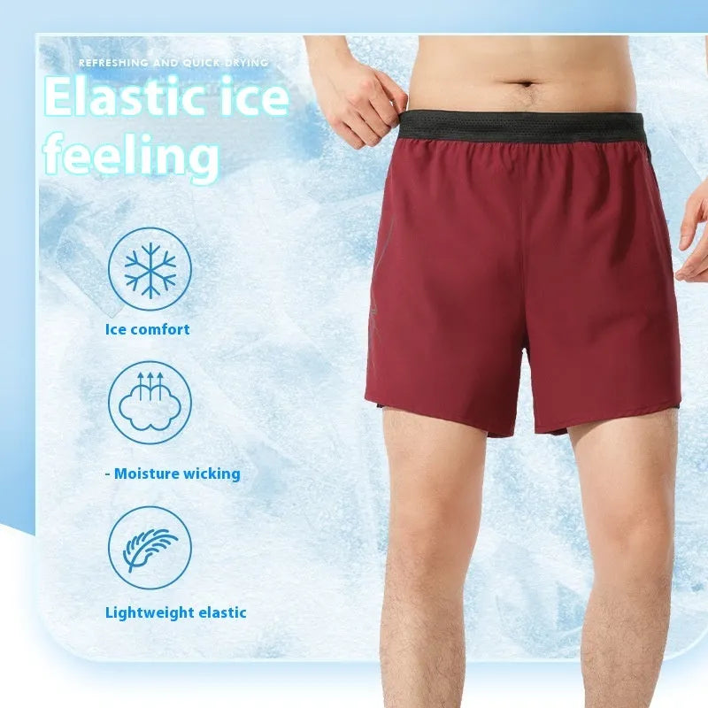Men's solid colour polyester basketball shorts with a low-waist design on a neutral background.