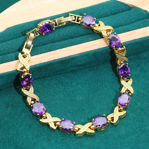 18k gold plated jewellery set with cubic zirconia stones, showing necklace, earrings, bracelet, and ring.