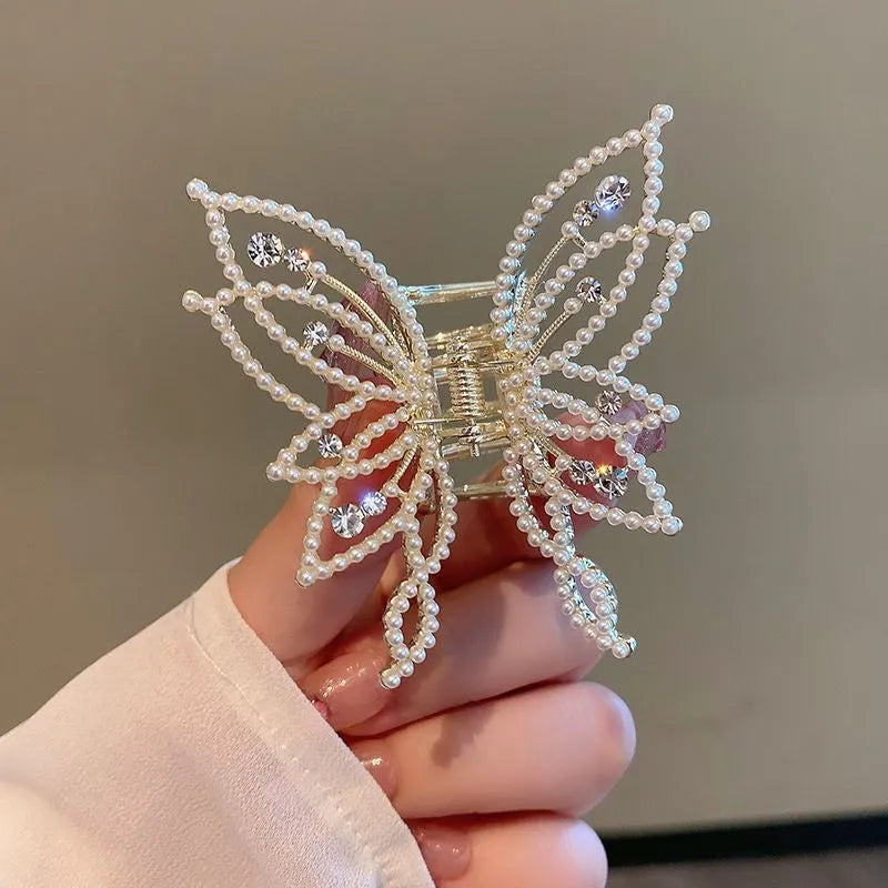 Butterfly-shaped alloy hair clip barrette for women, available in rhinestone or pearl style.