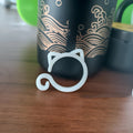 Coloured cat-shaped plastic plant clips for garden vine support