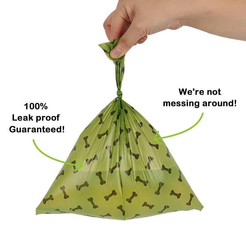 Military green degradable dog poop bags with black bone print, rolled with dispenser