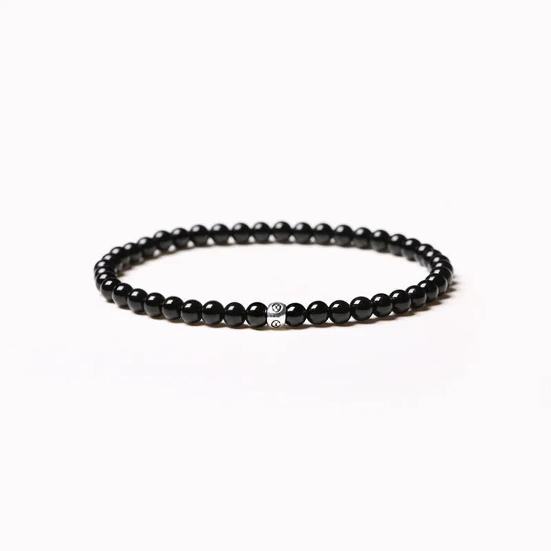 Geometric black agate bracelet with 4mm obsidian and blue San beads and cut surface details