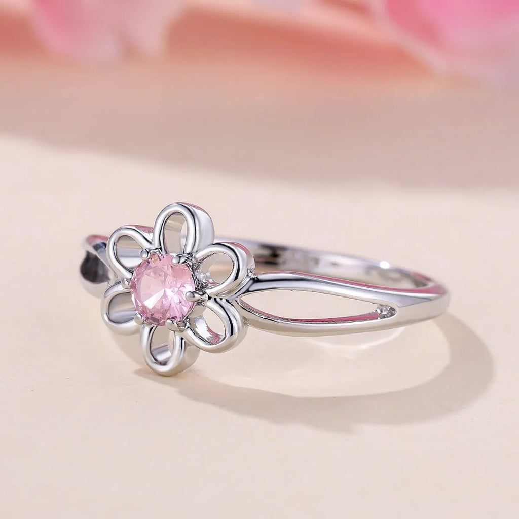 Lady's copper flower hollowed ring with electroplated finish in white gold powder colour on white background