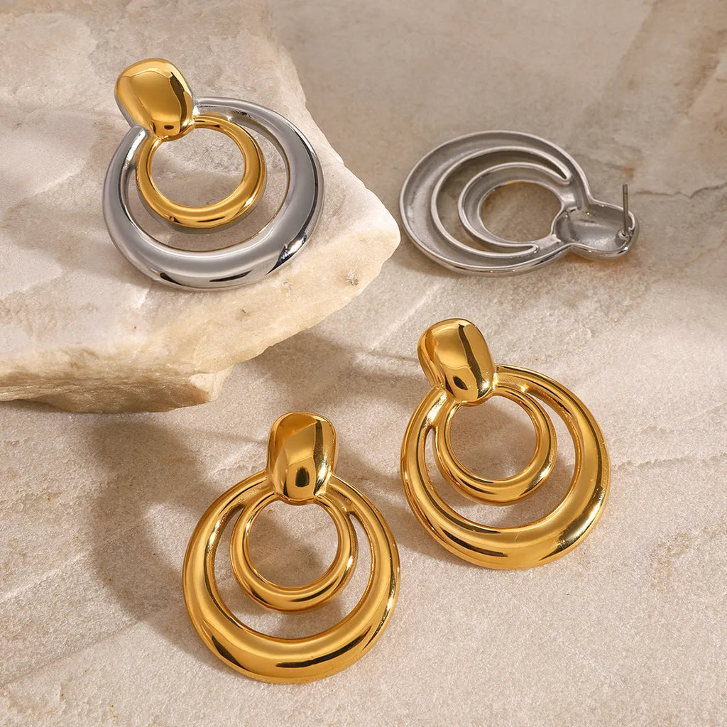 Round double layer hollow stud earrings with geometric design and 18K gold plated finish