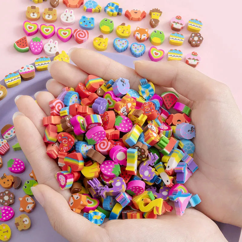 50 small colourful cartoon novelty erasers including fruit and animal shapes in a pearlescent film bag.