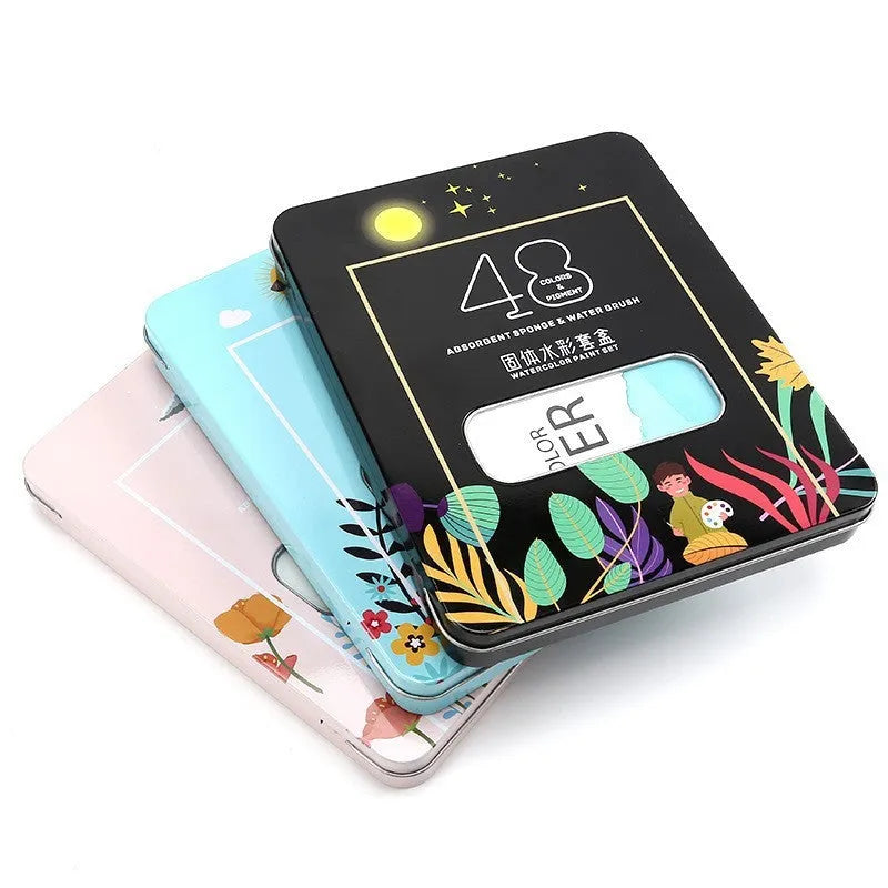 Solid watercolour paint set showing 48 colour pans with black knight, girl pink and sunshine blue shades