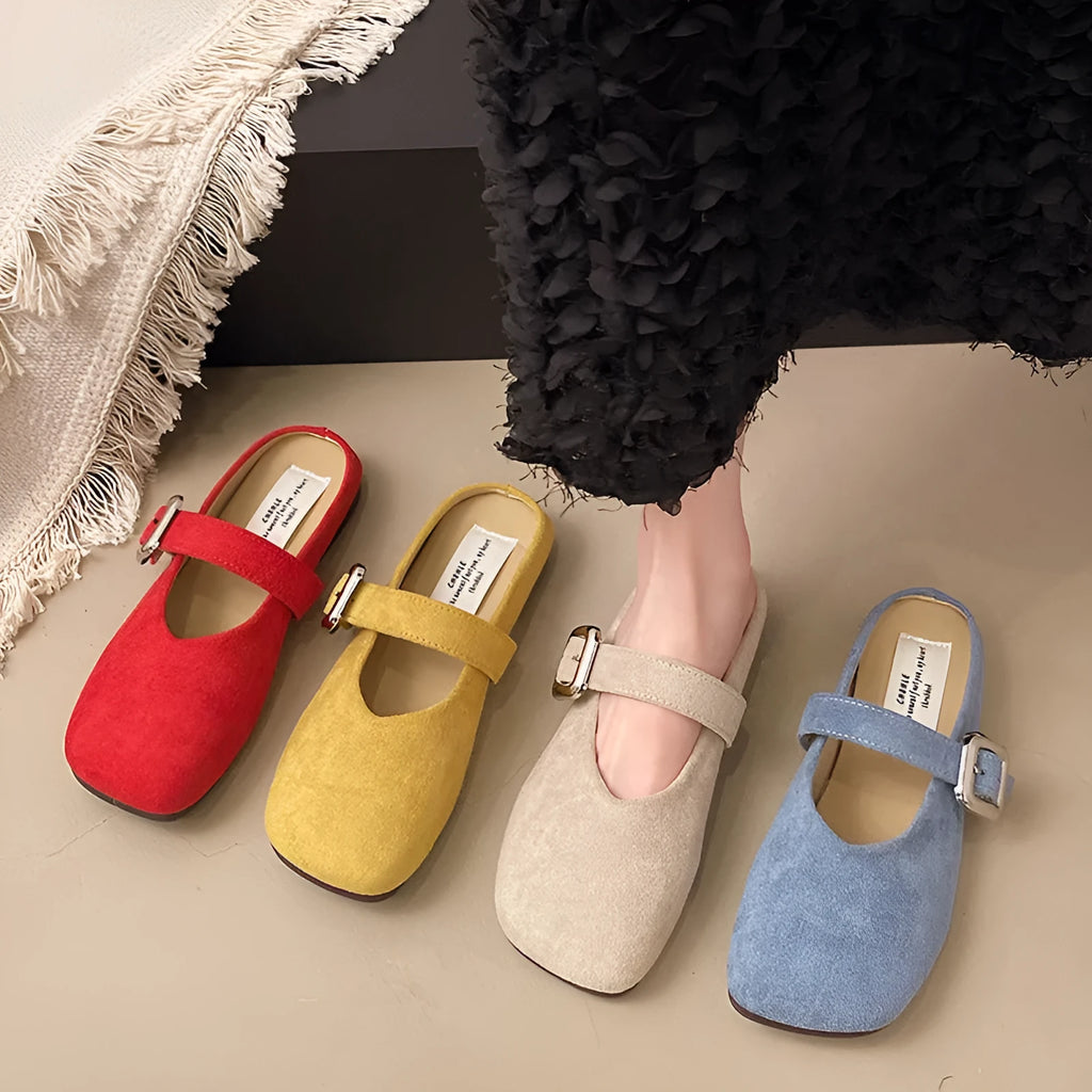 Women's flat closed toe slippers with square head in apricot, blue, red, or yellow colours on a rubber sole.