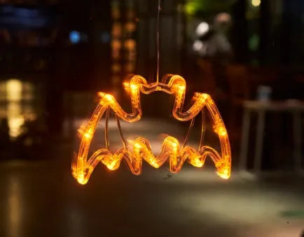 Set of seven Halloween LED hanging lights with spider, pumpkin, and ghost designs for window decoration
