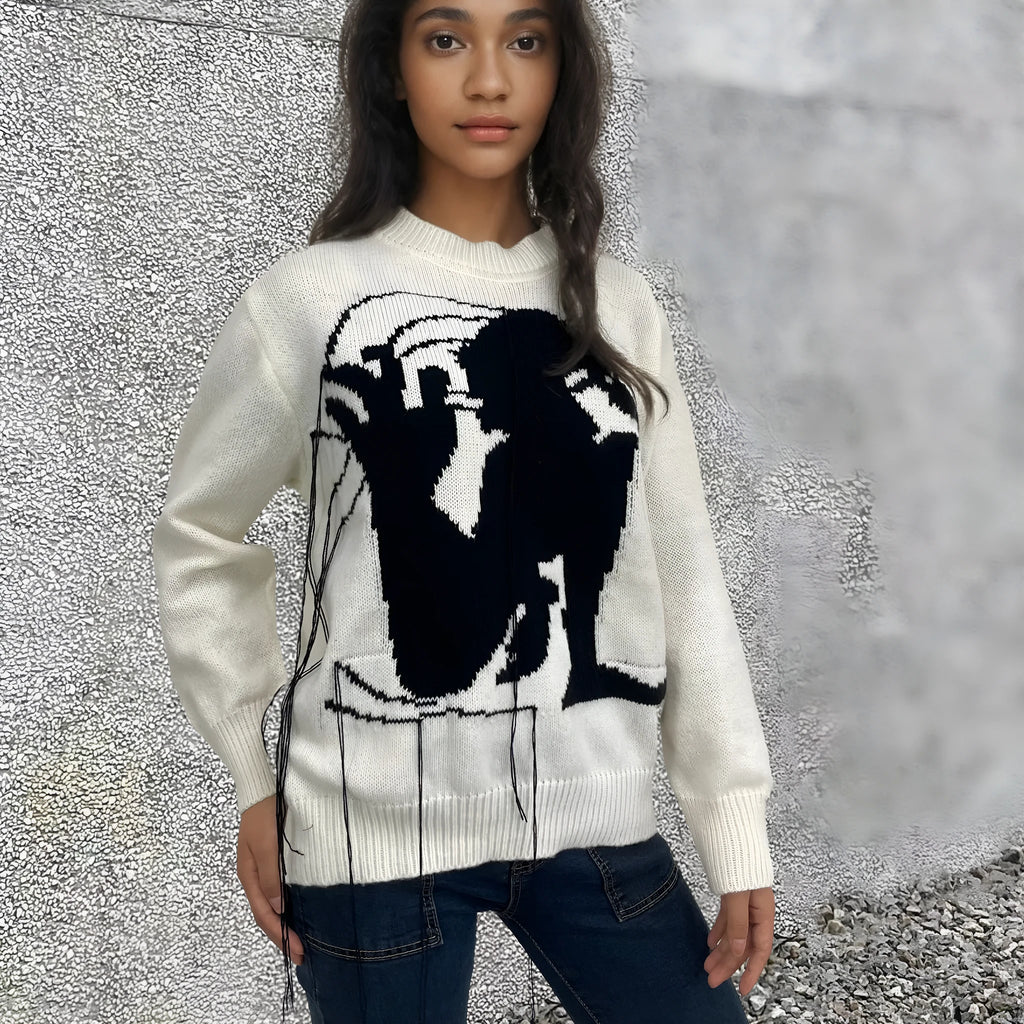 Women's loose alpaca wool tassel sweater in gray, round neck pullover style, side view on model
