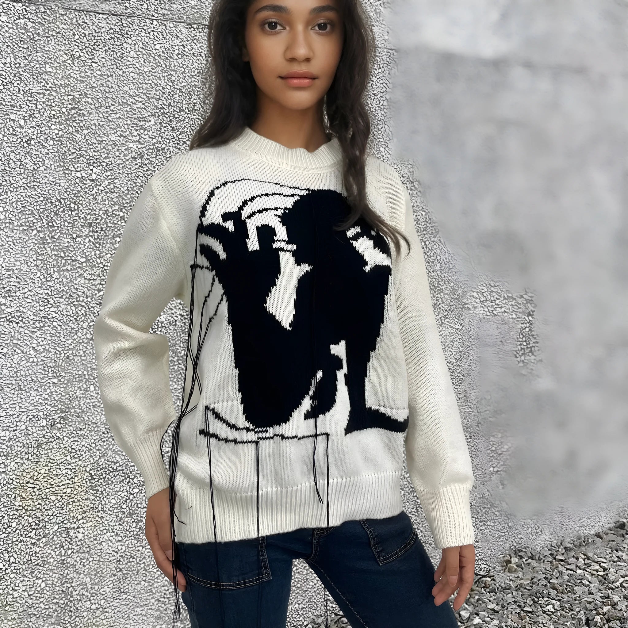 Women's loose alpaca wool tassel sweater in gray, round neck pullover style, side view on model