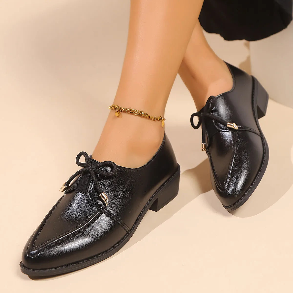 Women's flat shoes with a pointed toe and a choice of bow or buckle detail on the upper.
