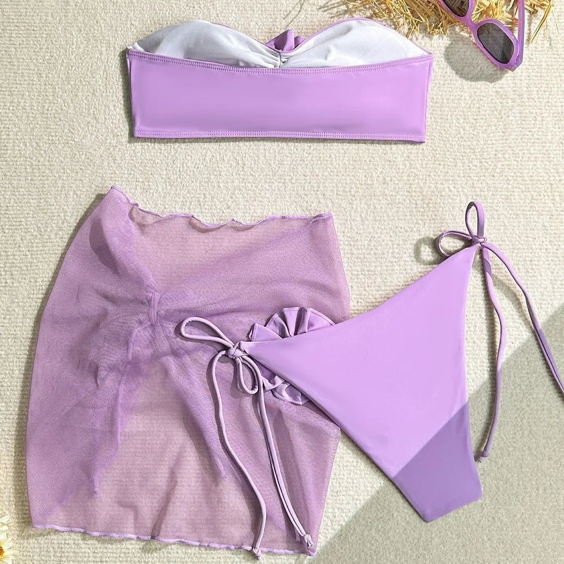 Women's pink tube top swimsuit with a large 3D flower tie and a matching detachable skirt.