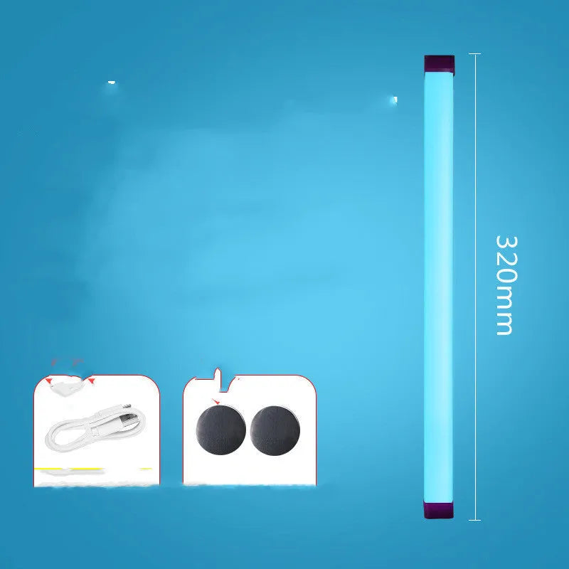 Blue and purple rechargeable LED tube stick light resting on a surface, showcasing its slim design.