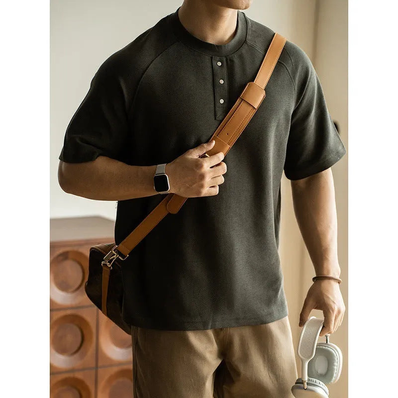 Men's smoky gray casual pullover top with raglan sleeves and a textured fabric.