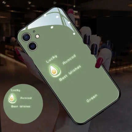 White Apple iPhone case with painted daisy pattern and illuminated voice-activated colour light on display.