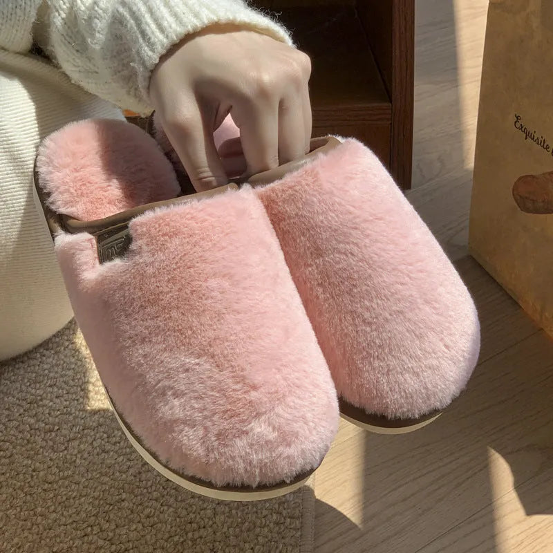 Solid colour PVC plush winter slippers for men and women on a home floor