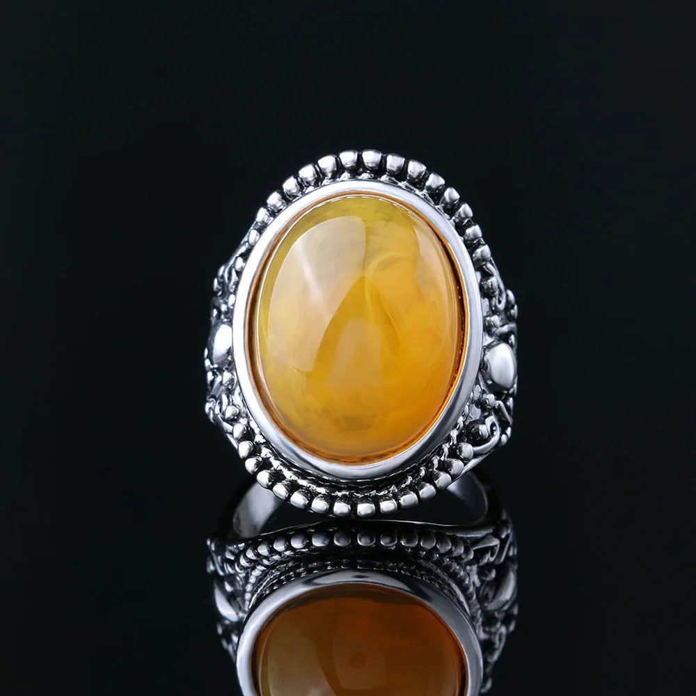 Retro geometric alloy ring with antique silver amber electroplating showing fluorescent beeswax elements