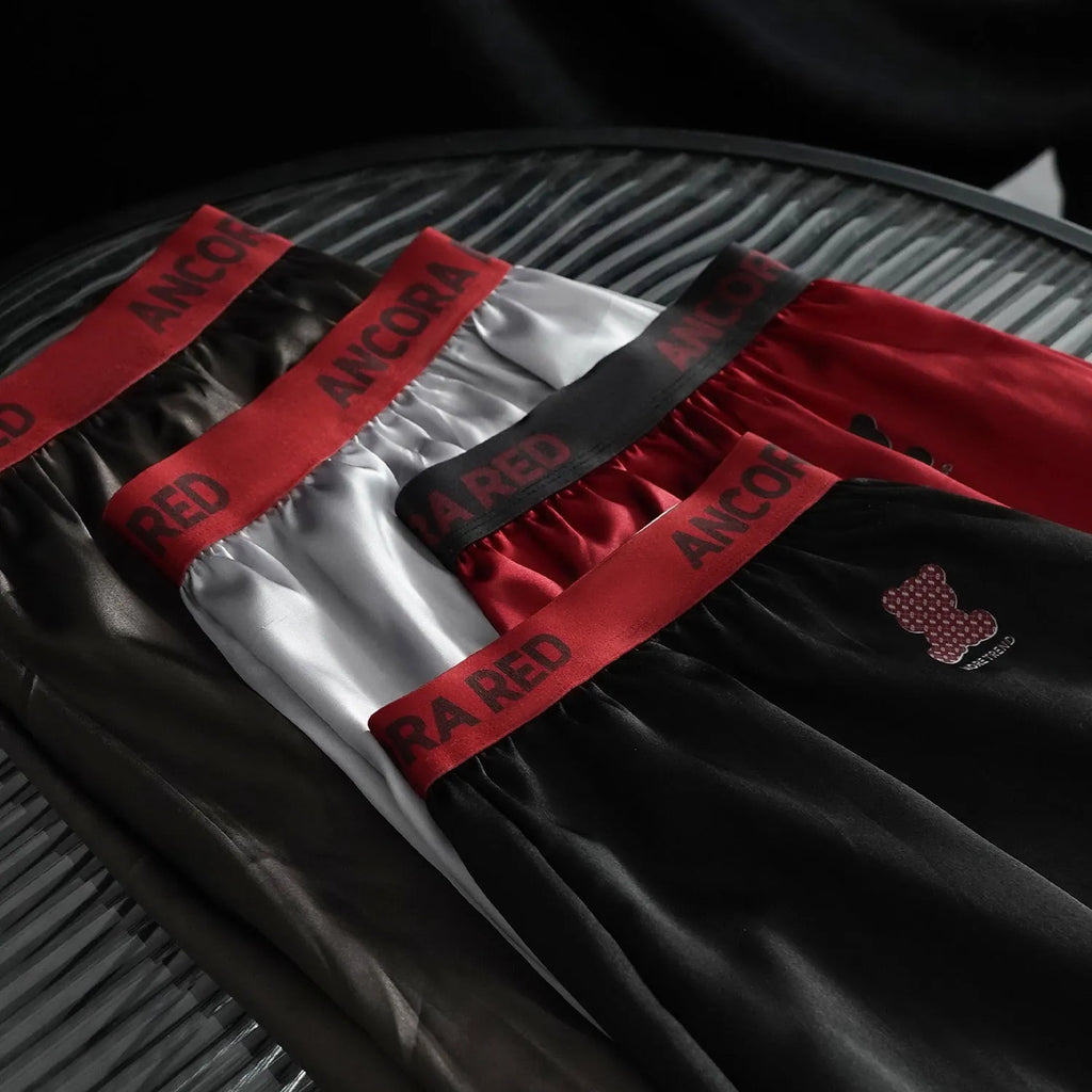Solid colour men's boxer briefs in polyester fabric showing mid-waist design