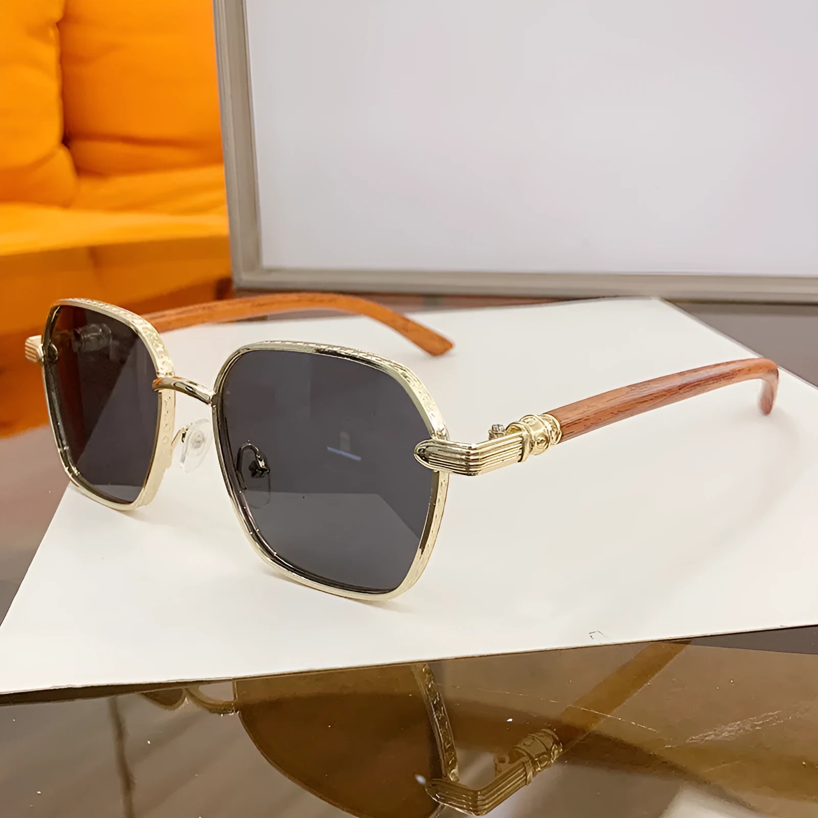Women's gold alloy frame glasses with wood grain pattern and multiple coloured interchangeable lenses.