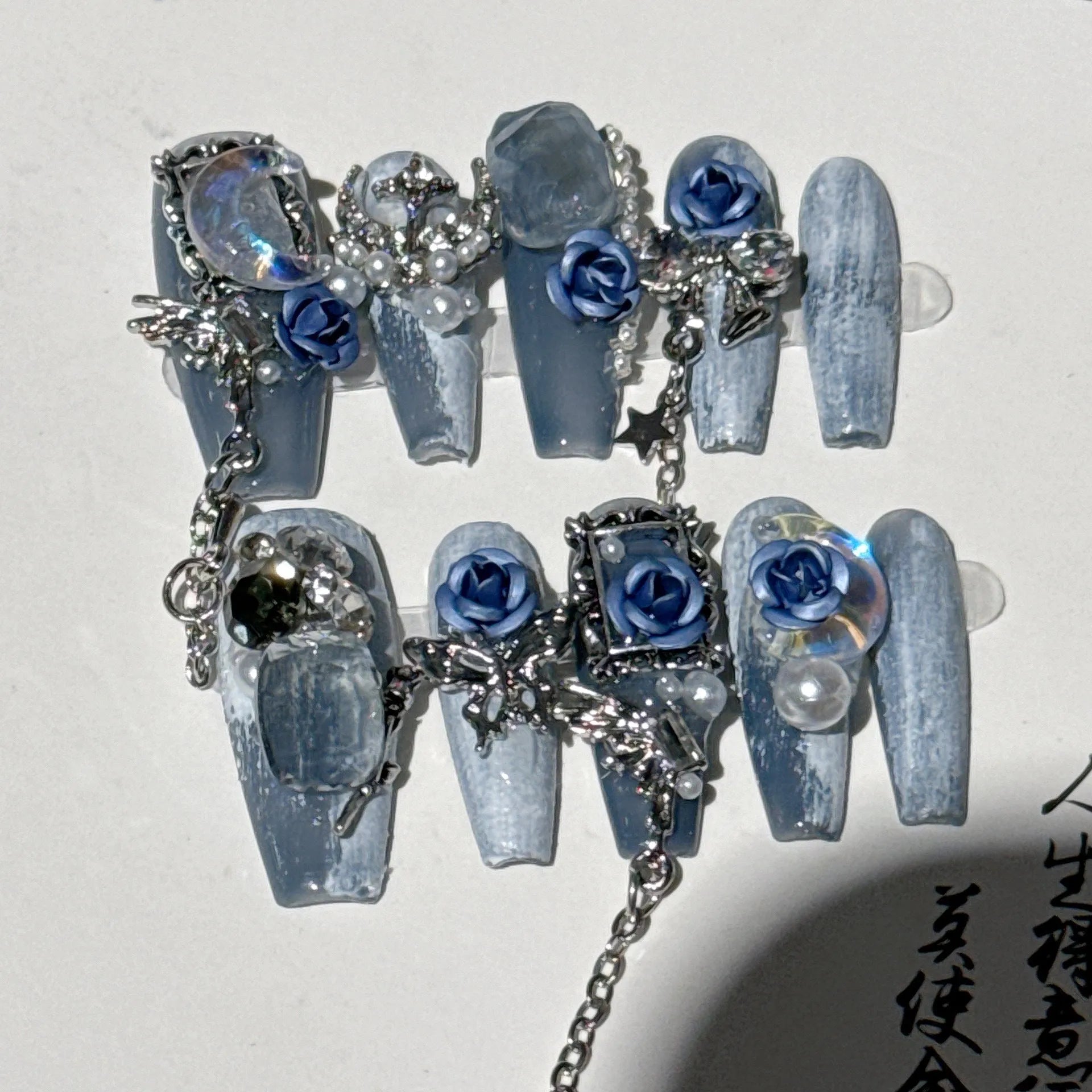 Heavy industry blue evening manicure set with ornate rose pattern and plastic armour suit