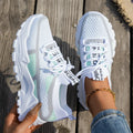 Women's Flyknit mesh lace-up sneakers in multiple colours on a white background.