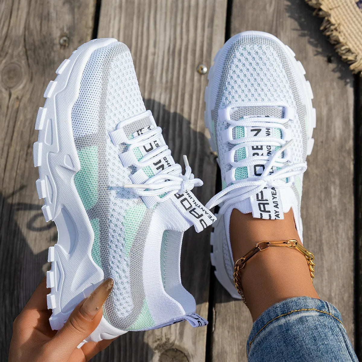 Women's Flyknit mesh lace-up sneakers in multiple colours on a white background.