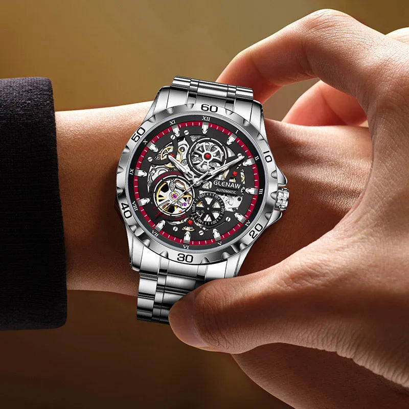 Men's silver mechanical watch with hollow-out dial showing movement and stainless steel strap