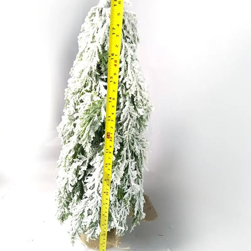 Small 24-inch plastic Christmas tree with PE snow sprayer effects and integrated lighting