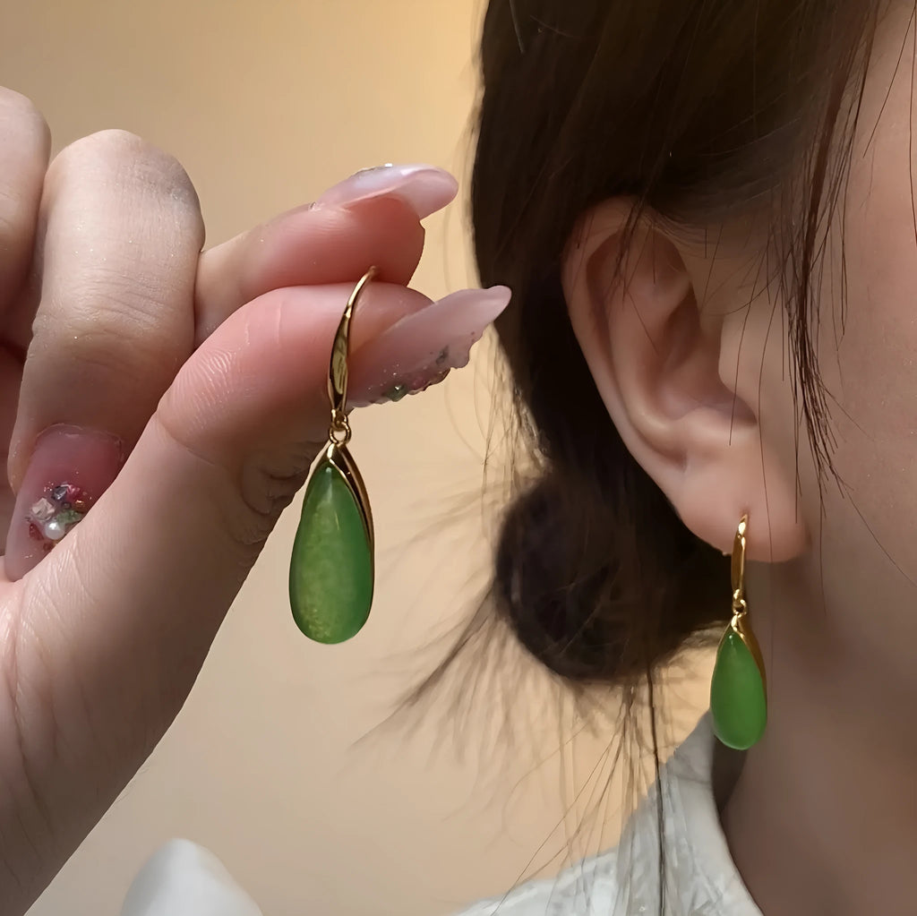 A pair of retro-style geometric water droplet earrings in jade green, made from electroplated copper.