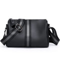Black genuine leather crossbody bag with one shoulder strap showing interior polyester lining
