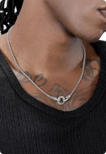 Polished S925 sterling silver necklace with a small pendant on a fine chain, shown at clavicle length.