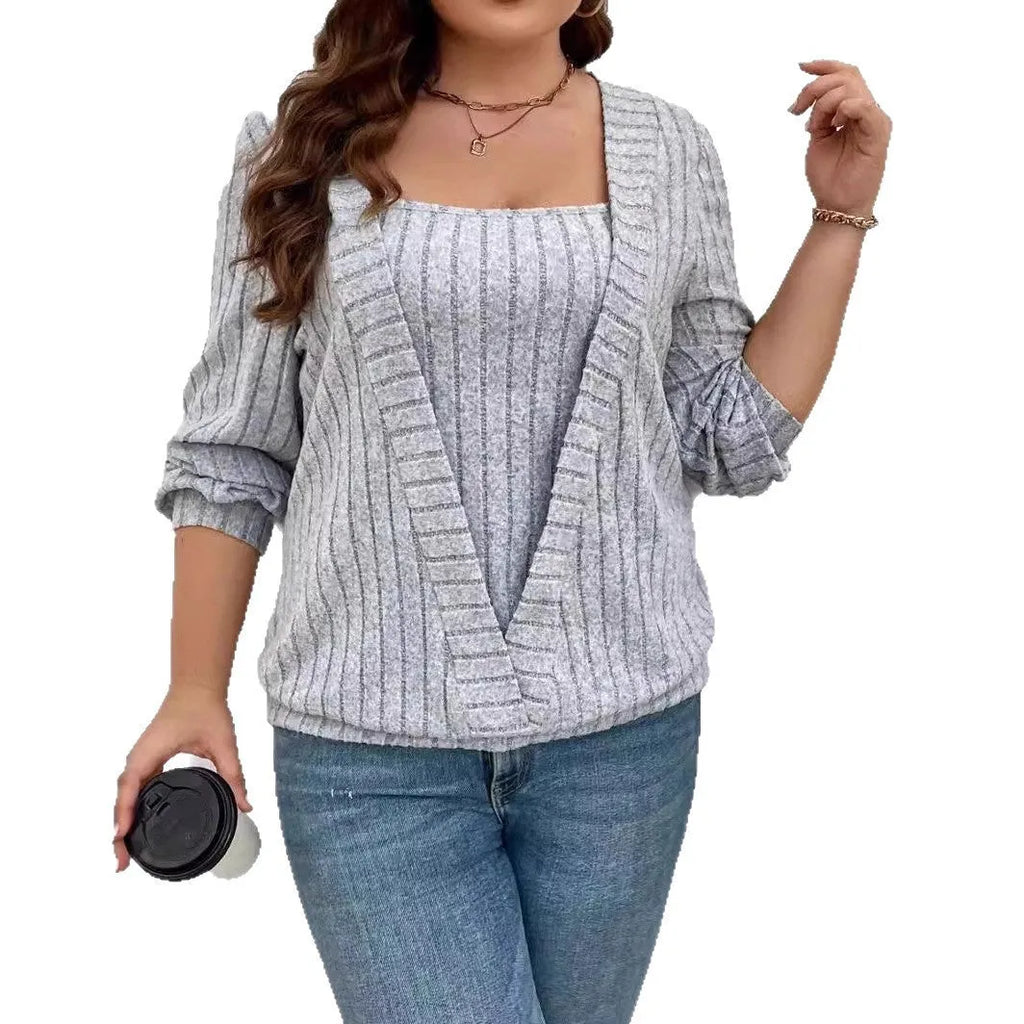 Loose fitting purple rib fabric V-neck long sleeve false two-piece suit on a hanger