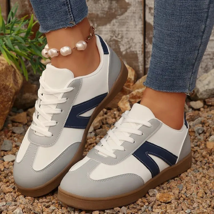 Women's blue flat German training hiking shoes with rubber sole and artificial PU upper, low-top lace-up style on neutral background