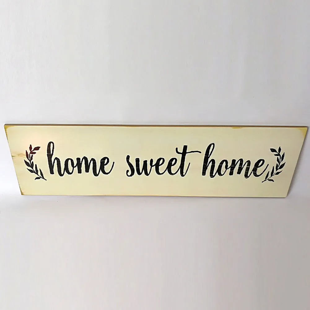 Wooden carved hanging ornament pendant in black, measuring 40cm by 12cm, displayed on a wall