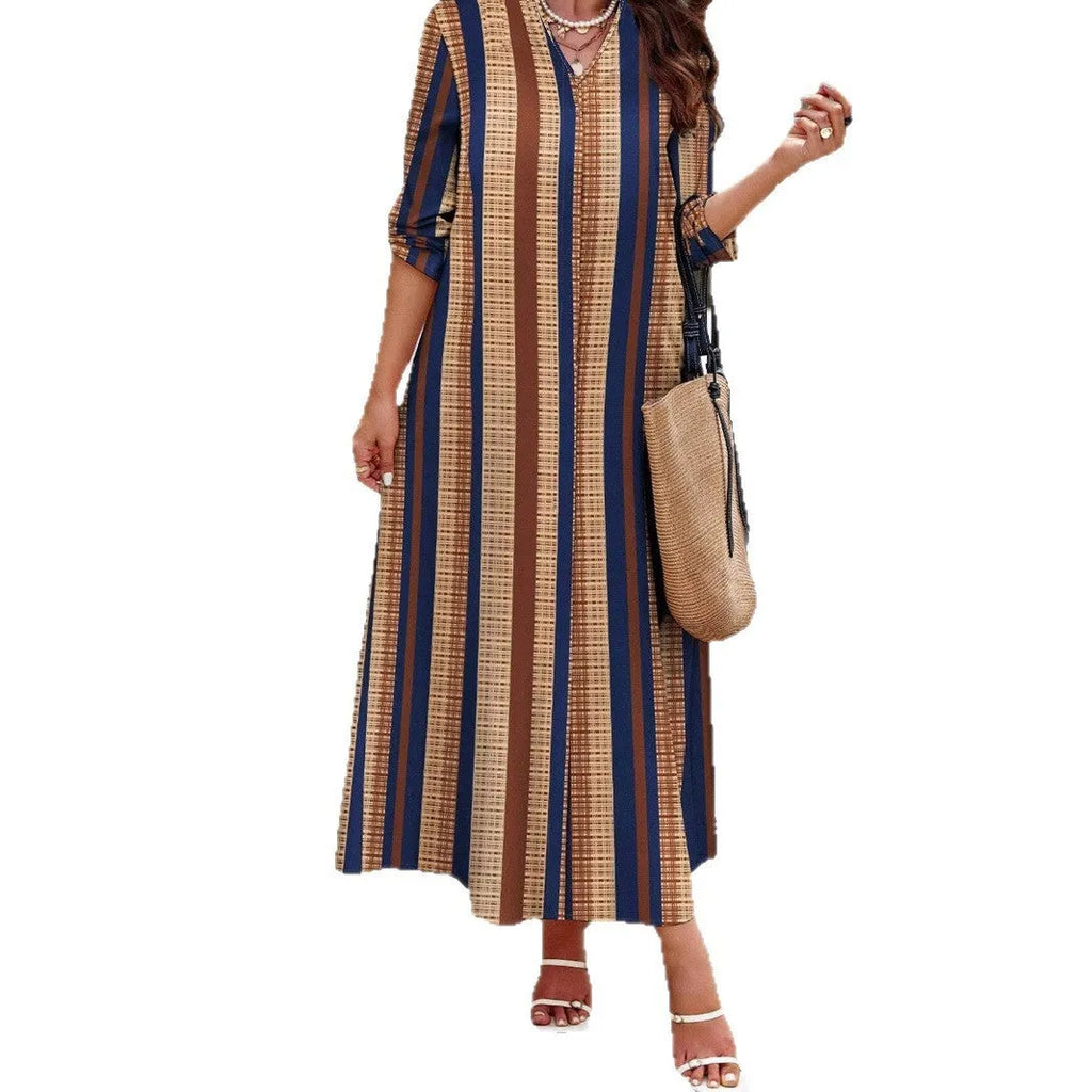 Camel coloured striped V-neck long sleeve dress with an A-line skirt on a hanger.