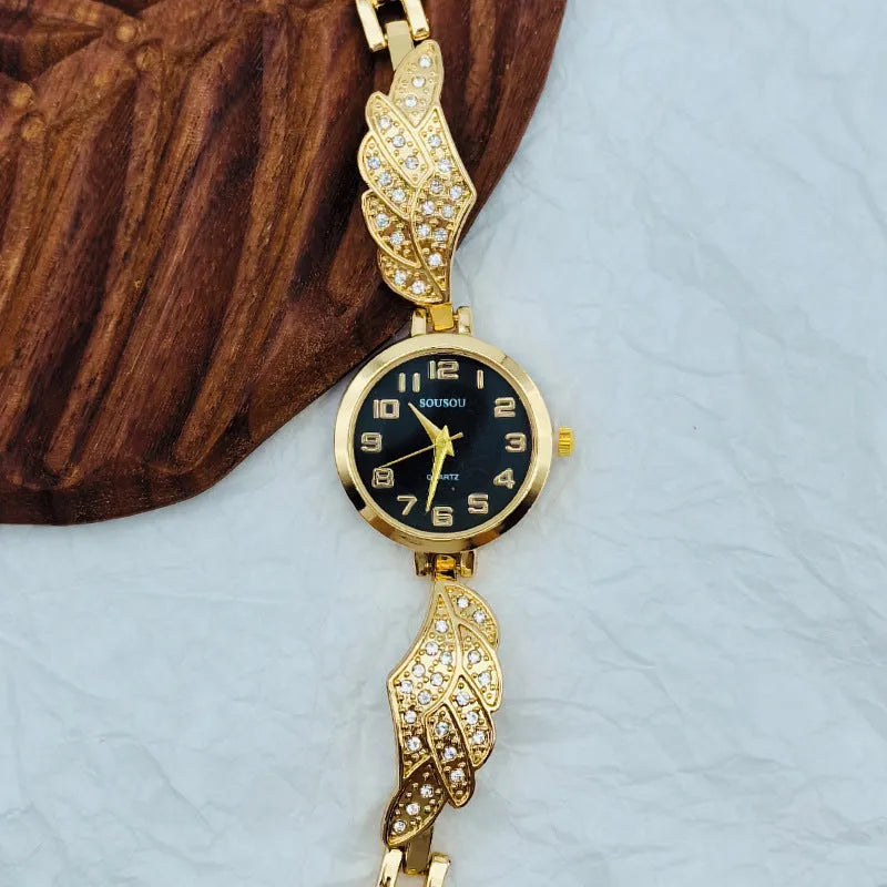 Women's stainless steel watch with round dial and Vachette clasp buckle showing gold face option