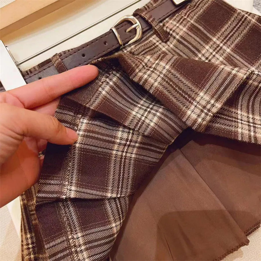 Girls' plaid pleated skirt in cotton blend fabric shown in A-line style for casual wear