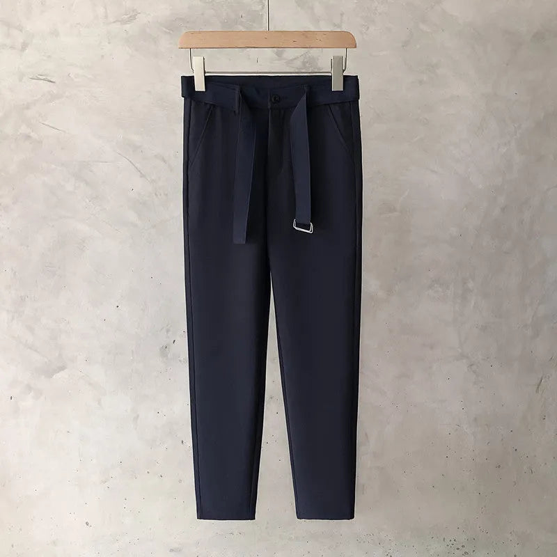Boys slim straight wool trousers in black showing tapered cut and straight leg opening