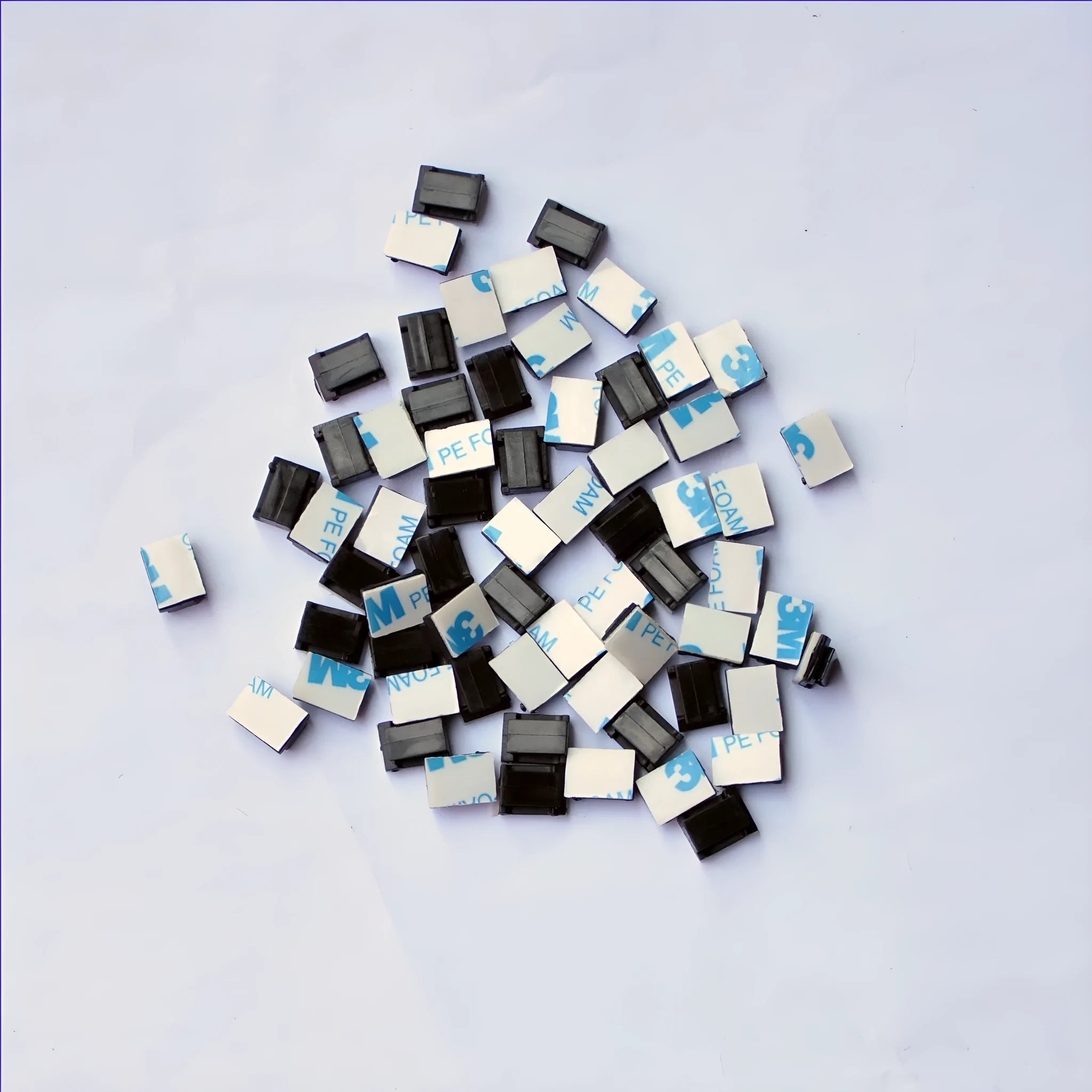 Black PA66 nylon wire management clips for automotive and electronic cable organisation